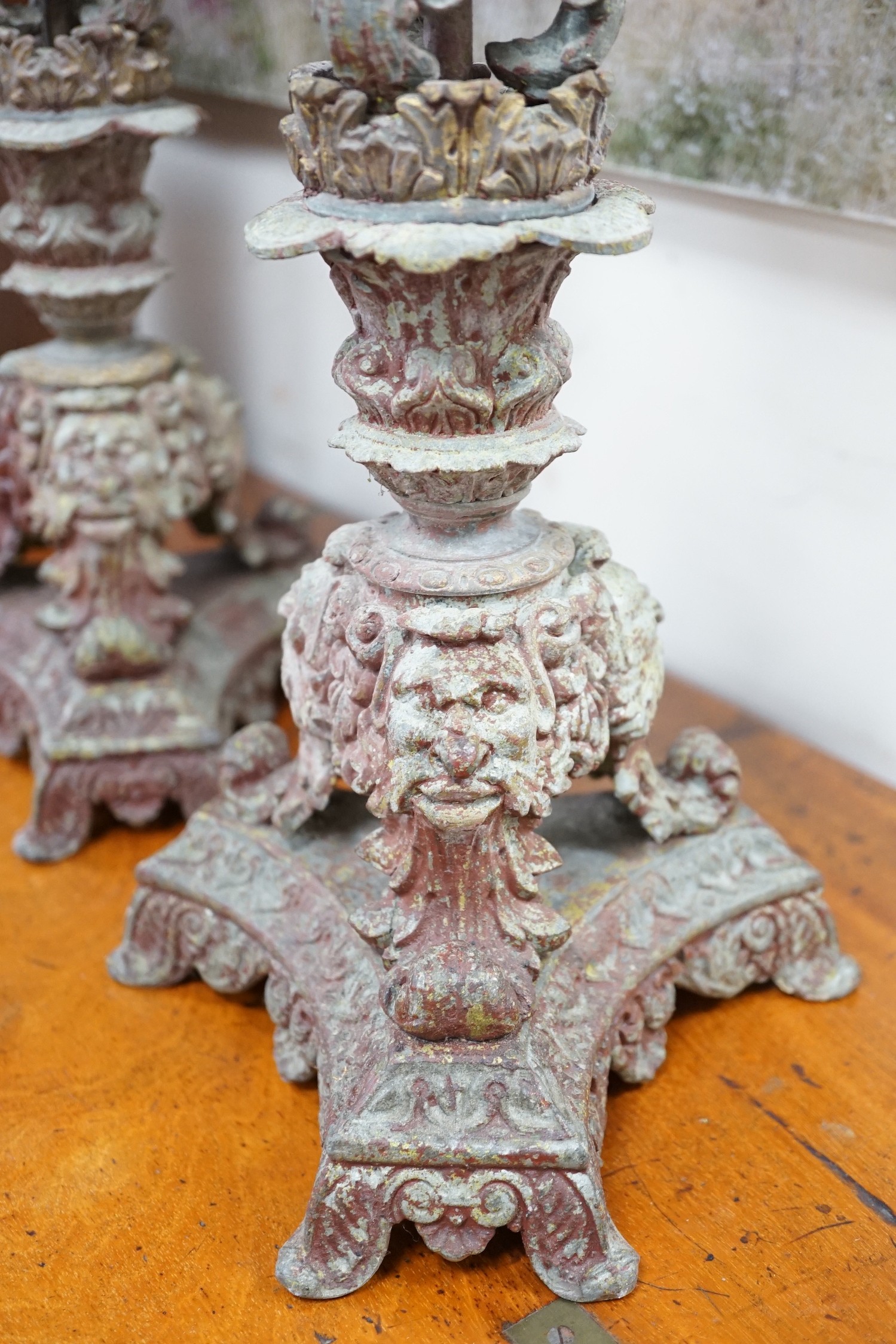 A pair French cast metal candlesticks. 47cm tall